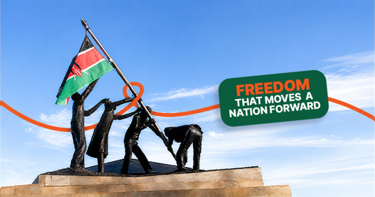 Statue of people raising the Kenyan flag against a clear blue sky, with the text "Freedom That Moves a Nation Forward" celebrating Kenya's Madaraka Day.