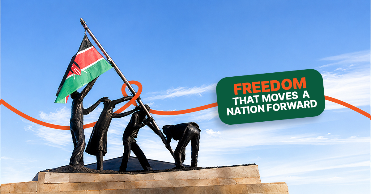 Statue of people raising the Kenyan flag against a clear blue sky, with the text "Freedom That Moves a Nation Forward" celebrating Kenya's Madaraka Day.