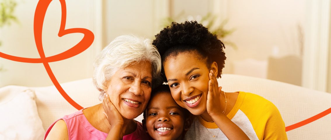 Mother receiving thoughtful Mother’s Day gifts from family while smiling and celebrating love from abroad with financial support through Remit Choice